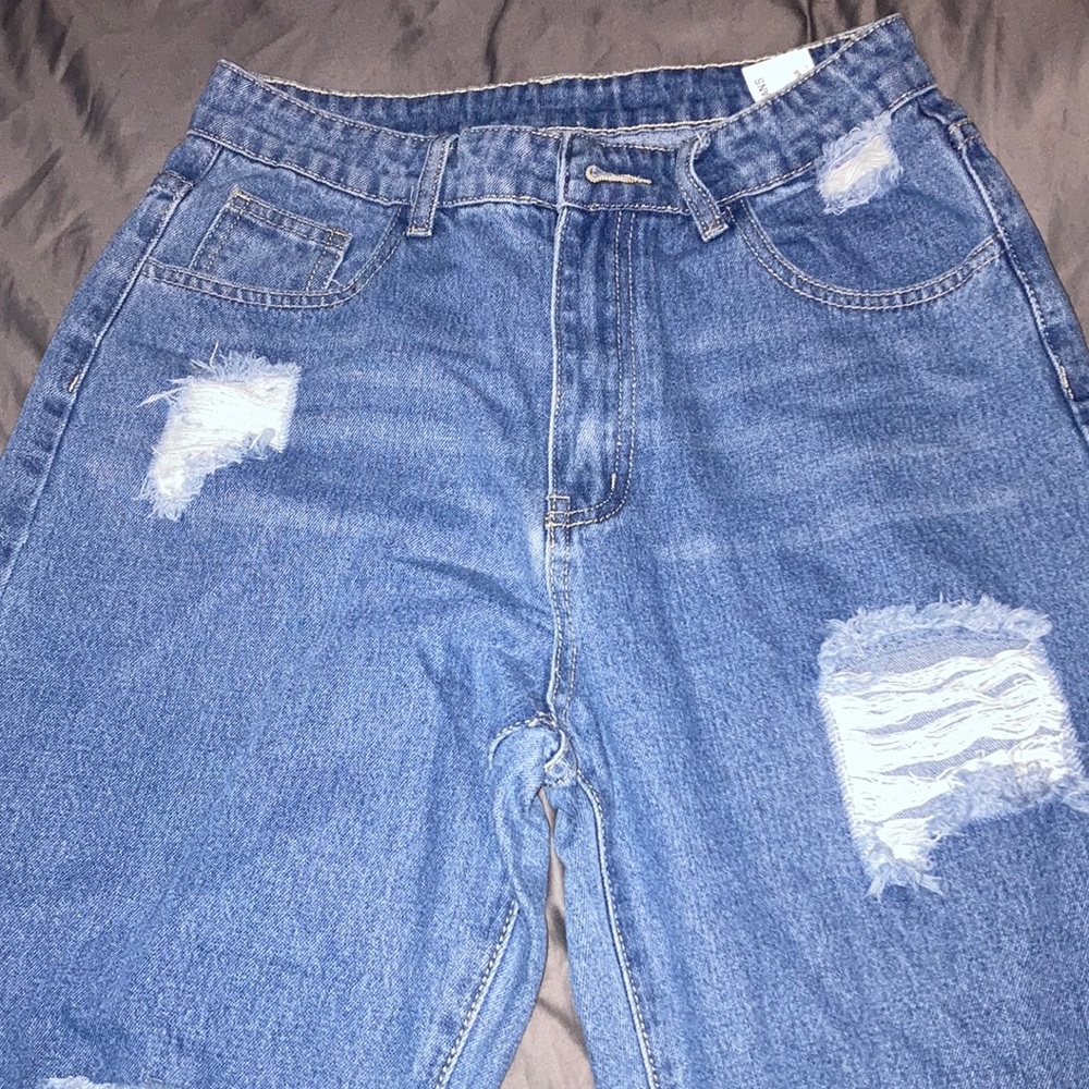 Unworn high rise jeans